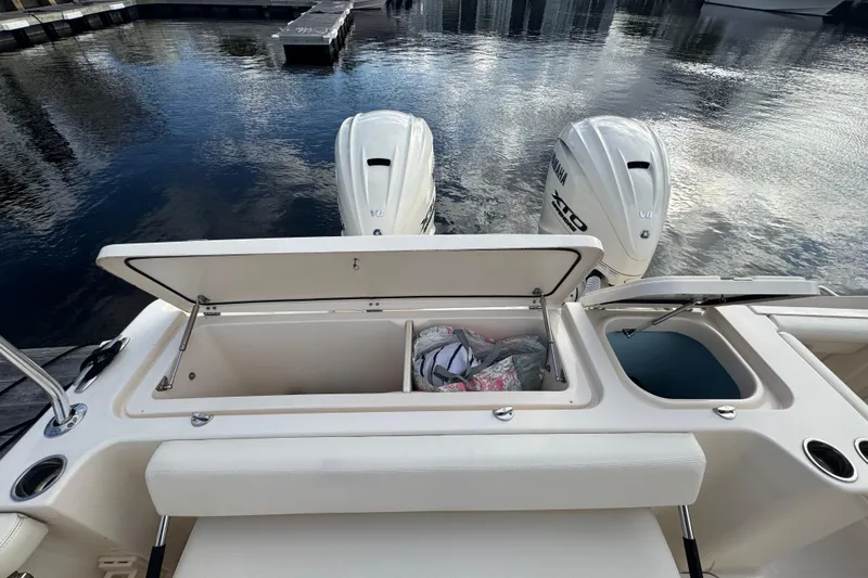 Texas Crewed Yacht Photos Pics 2024 Grady-White Freedom 335 boat with open storage compartments and twin Yamaha engines.