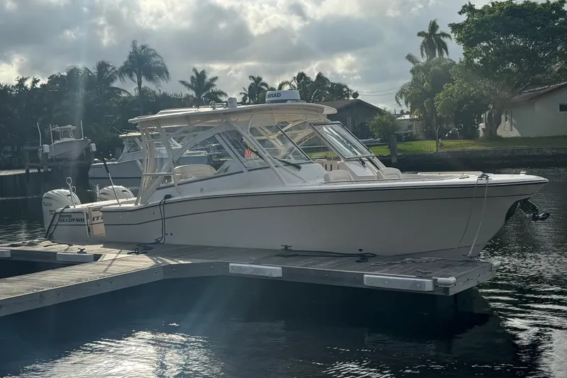 Texas Crewed Yacht Photos Pics 2024 Grady-White Freedom 335 boat docked on a sunny day.