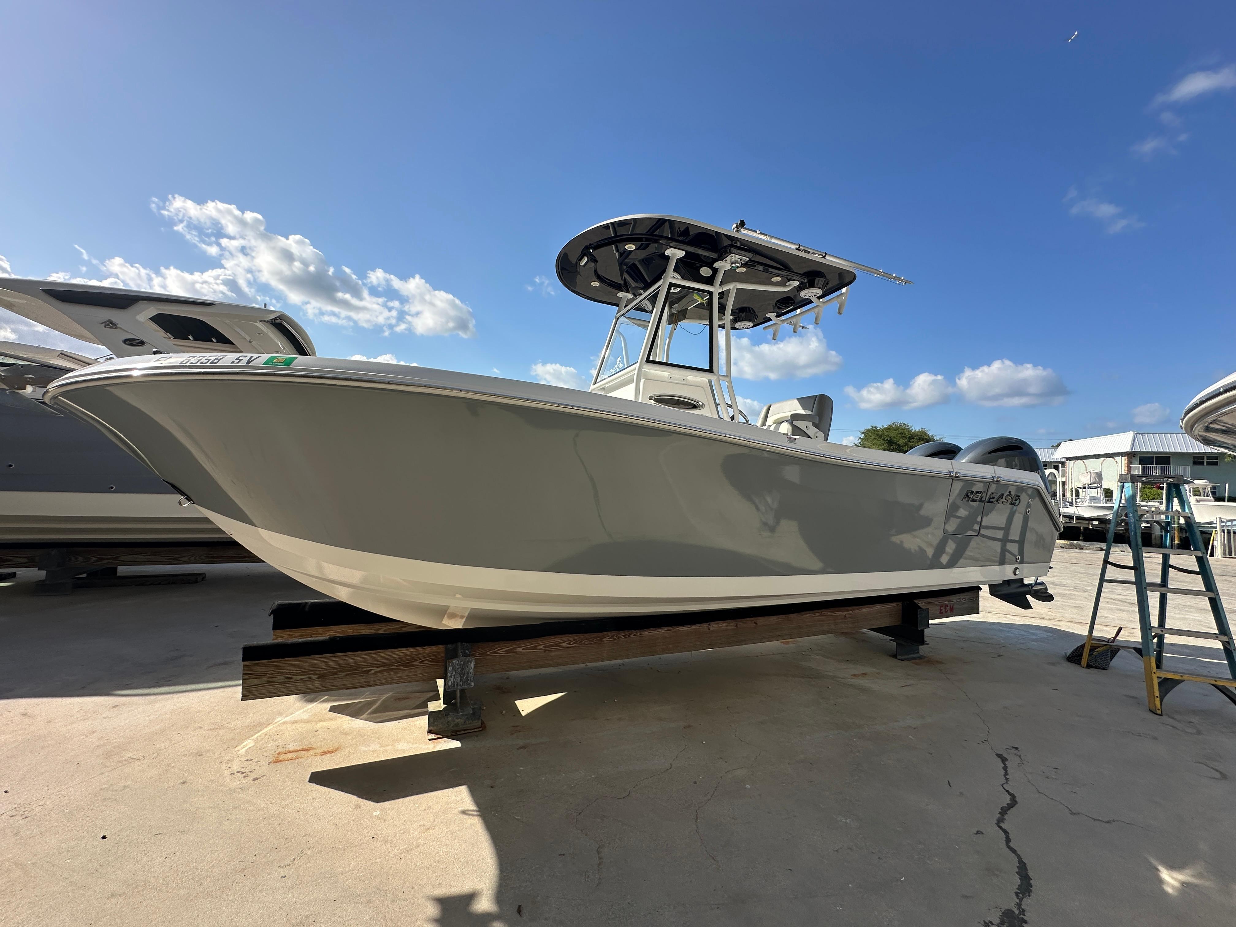 2021 Release 240 RX boat on display under clear blue sky.