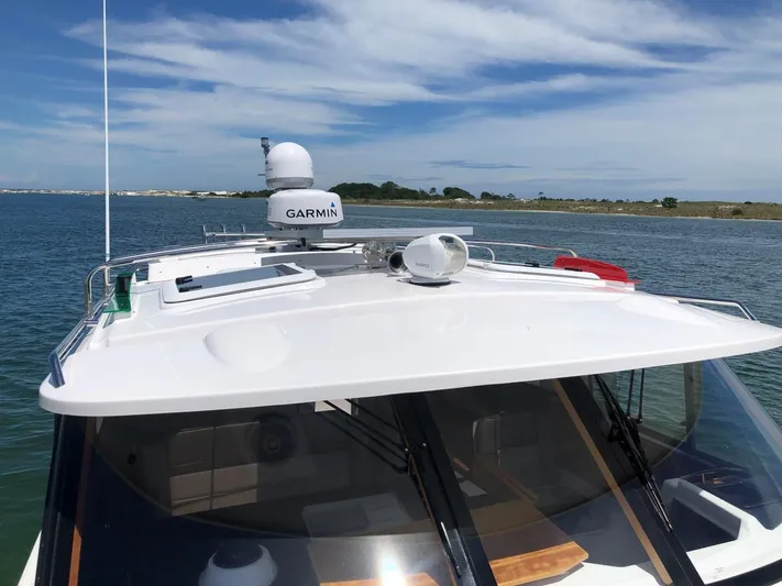  Yacht Photos Pics 2025 Cutwater C-32 Sedan boat with Garmin equipment on a sunny day.