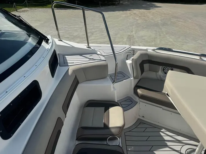  Yacht Photos Pics 2023 Solara S-310 CW boat interior with cushioned seating and sleek design.