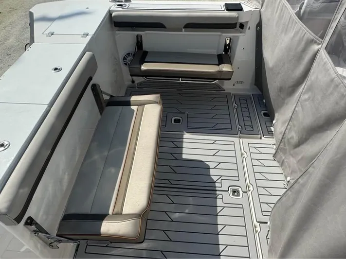  Yacht Photos Pics 2023 Solara S-310 CW boat interior with foldable seats and sleek flooring design.