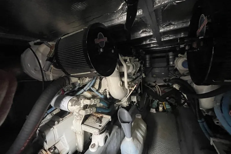 Double Kickback IV Yacht Photos Pics Engine room of 1998 Sea Ray 480 Sedan Bridge with visible components and equipment.