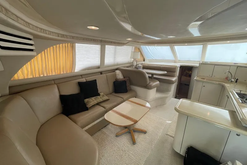 Double Kickback IV Yacht Photos Pics Luxurious interior of a 1998 Sea Ray 480 Sedan Bridge yacht with elegant seating and modern amenities.