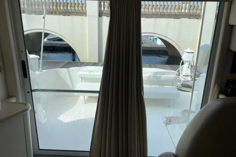 Double Kickback IV Yacht Photos Pics Interior view of 1998 Sea Ray 480 Sedan Bridge yacht, showing deck and bridge outside.