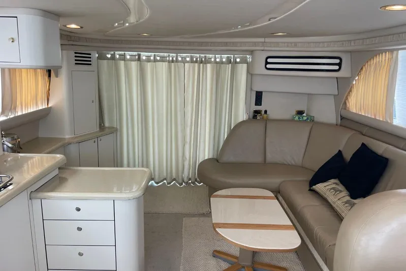 Double Kickback IV Yacht Photos Pics Luxurious interior of 1998 Sea Ray 480 Sedan Bridge yacht with modern furnishings.