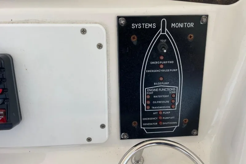 Double Kickback IV Yacht Photos Pics Control panel of a 1998 Sea Ray 480 Sedan Bridge boat systems monitor.