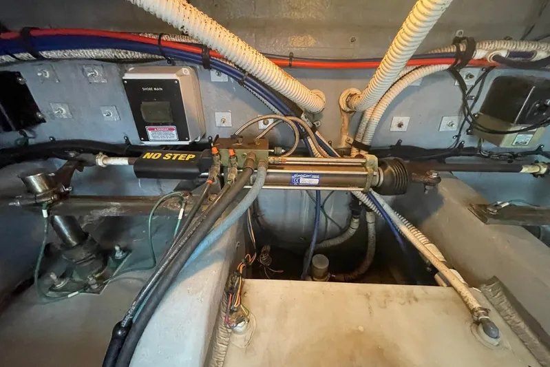 Double Kickback IV Yacht Photos Pics Engine room of a 1998 Sea Ray 480 Sedan Bridge with hydraulic steering components.