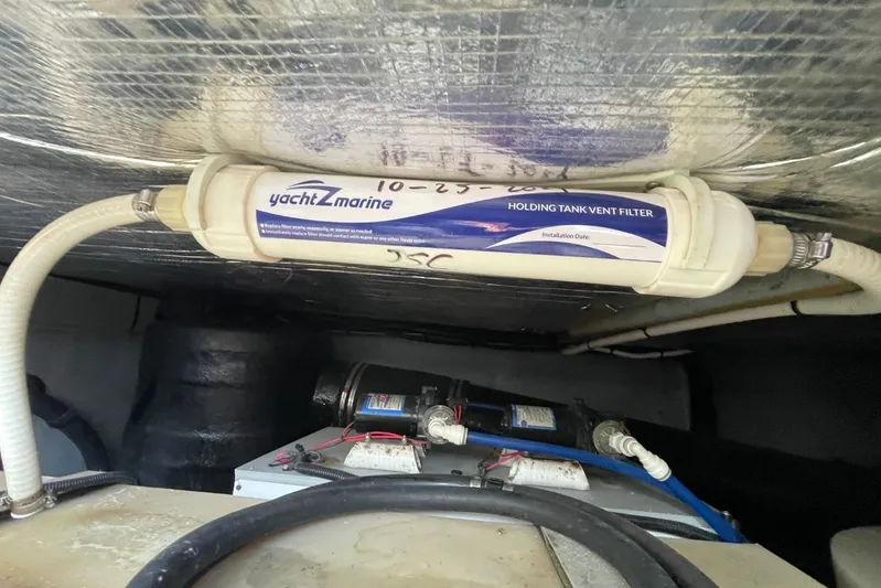 Double Kickback IV Yacht Photos Pics Holding tank vent filter in 1998 Sea Ray 480 Sedan Bridge yacht engine room.