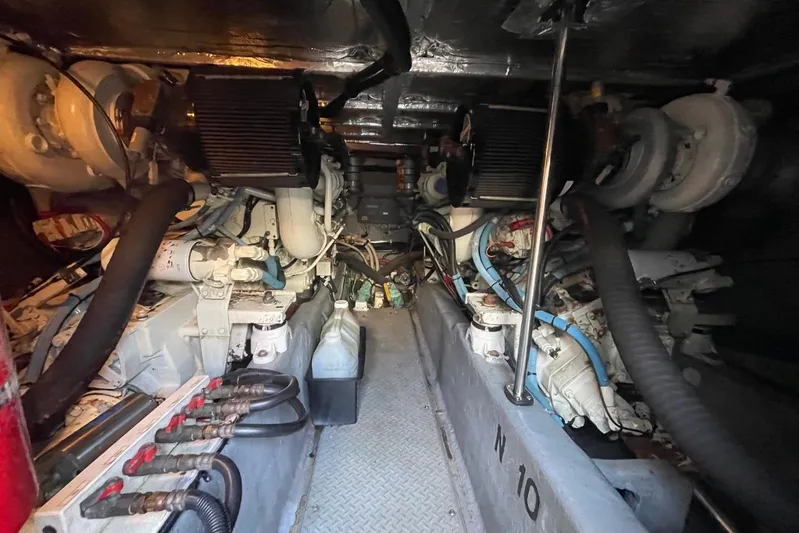 Double Kickback IV Yacht Photos Pics Engine room of a 1998 Sea Ray 480 Sedan Bridge yacht, showcasing mechanical components.