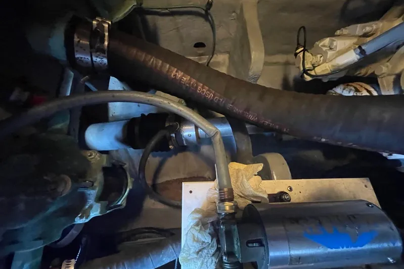 Double Kickback IV Yacht Photos Pics Engine compartment of a 1998 Sea Ray 480 Sedan Bridge with hoses and components.