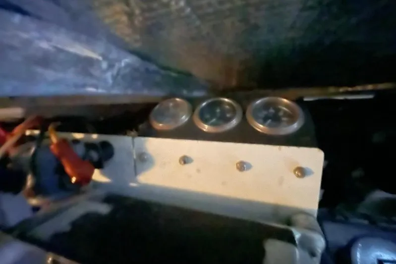 Double Kickback IV Yacht Photos Pics 1998 Sea Ray 480 Sedan Bridge engine compartment with gauges and wiring.