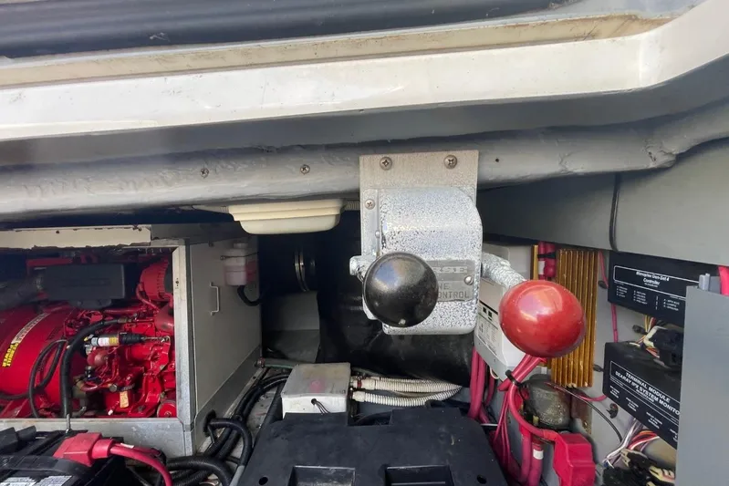 Double Kickback IV Yacht Photos Pics Engine room of 1998 Sea Ray 480 Sedan Bridge with control levers and wiring.