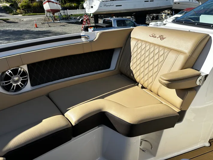  Yacht Photos Pics Luxurious seating on 2023 Sea Ray 280 SLX boat with tan upholstery and speaker.