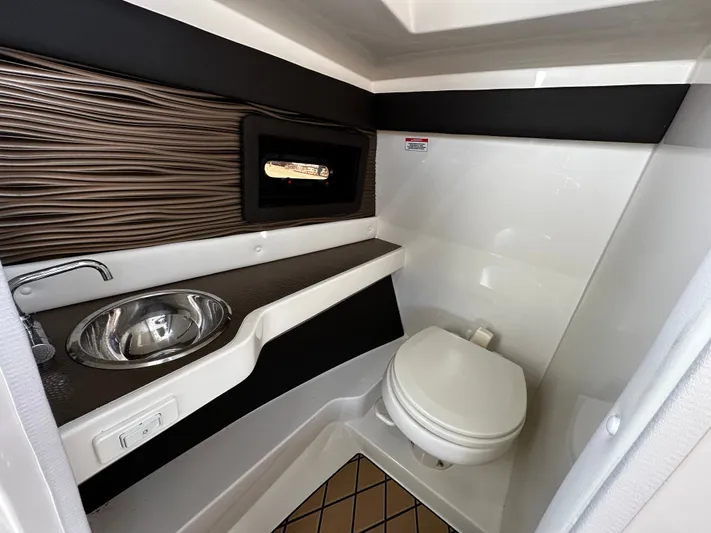  Yacht Photos Pics 2023 Sea Ray 280 SLX boat interior bathroom with sink and toilet.