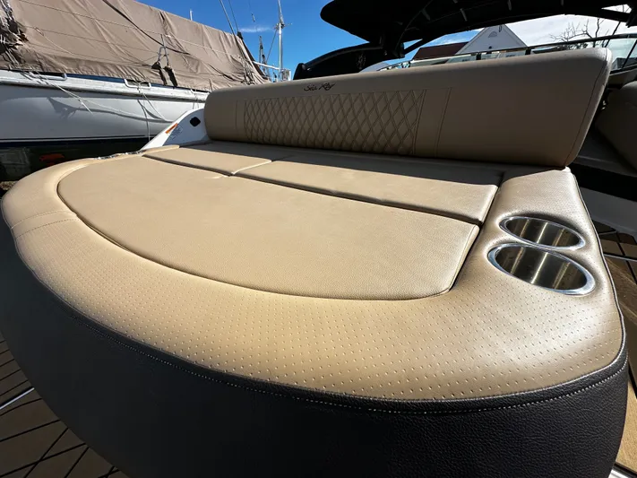  Yacht Photos Pics Luxurious seating on 2023 Sea Ray 280 SLX boat with cup holders and elegant design.