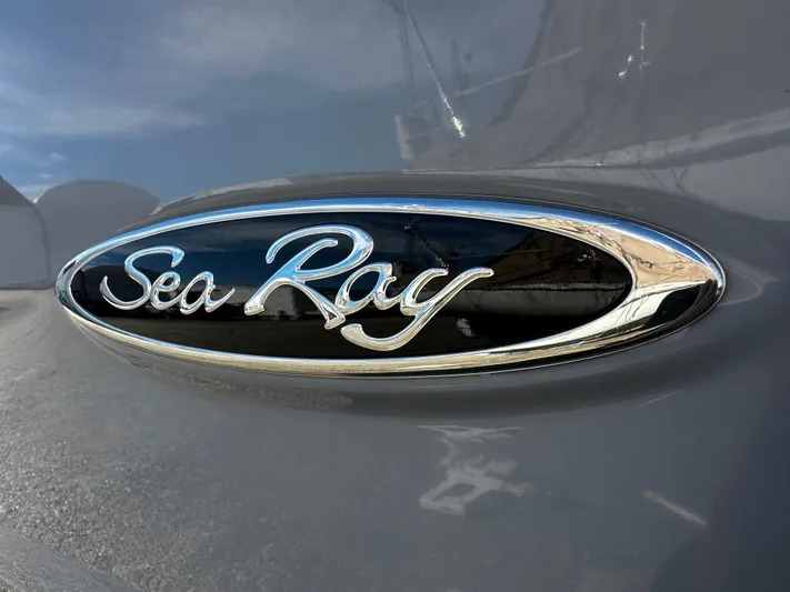  Yacht Photos Pics 2023 Sea Ray 280 SLX logo on sleek boat exterior.