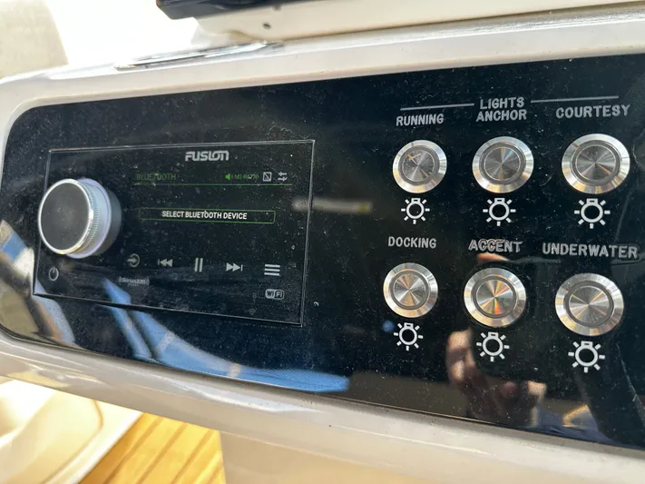  Yacht Photos Pics Control panel of 2023 Sea Ray 280 SLX boat with Bluetooth and lighting options.
