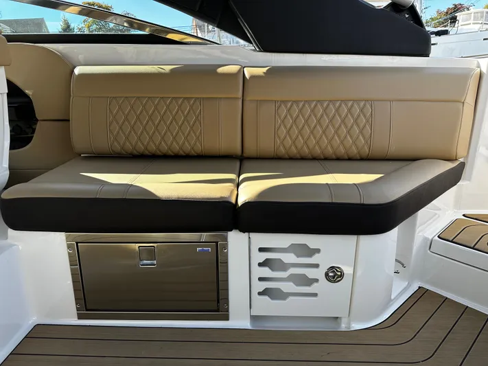  Yacht Photos Pics Luxurious seating on 2023 Sea Ray 280 SLX boat with tan and black upholstery.