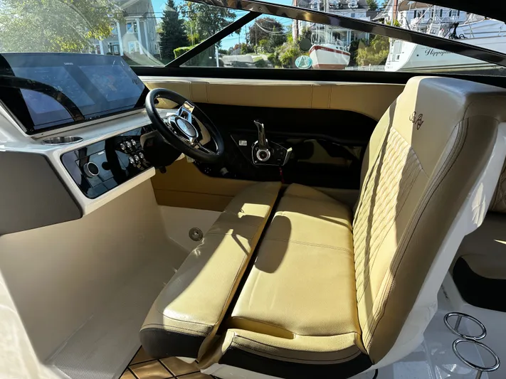  Yacht Photos Pics 2023 Sea Ray 280 SLX boat interior with beige seating and modern dashboard.