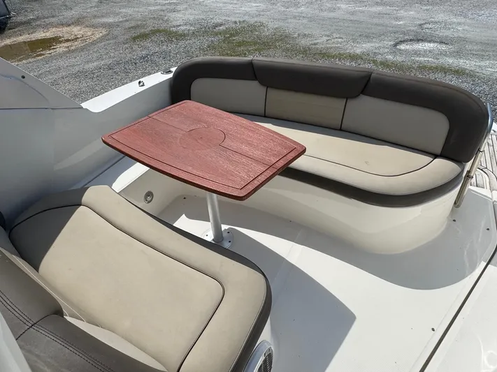 Max Dream Yacht Photos Pics 2014 Sea Ray 330 Sundancer boat seating area with wooden table.