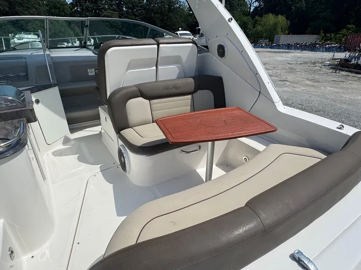 Max Dream Yacht Photos Pics 2014 Sea Ray 330 Sundancer interior with seating and wooden table.