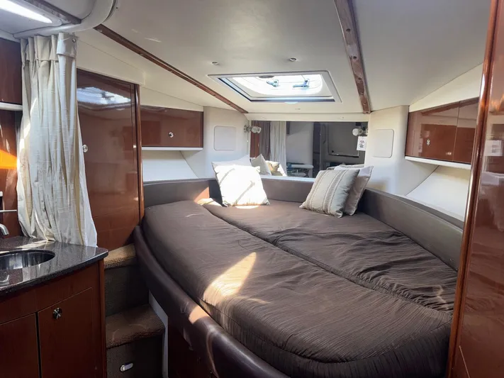 Max Dream Yacht Photos Pics Luxurious interior cabin of 2014 Sea Ray 330 Sundancer yacht with cozy bedding.
