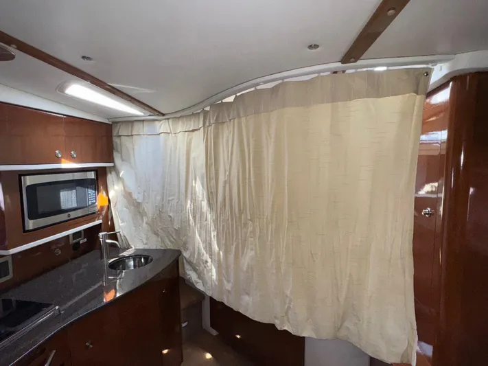 Max Dream Yacht Photos Pics Interior of 2014 Sea Ray 330 Sundancer with kitchenette and curtain divider.