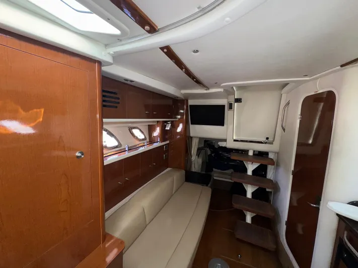 Max Dream Yacht Photos Pics 2014 Sea Ray 330 Sundancer interior with wood finish, beige seating, and modern amenities.