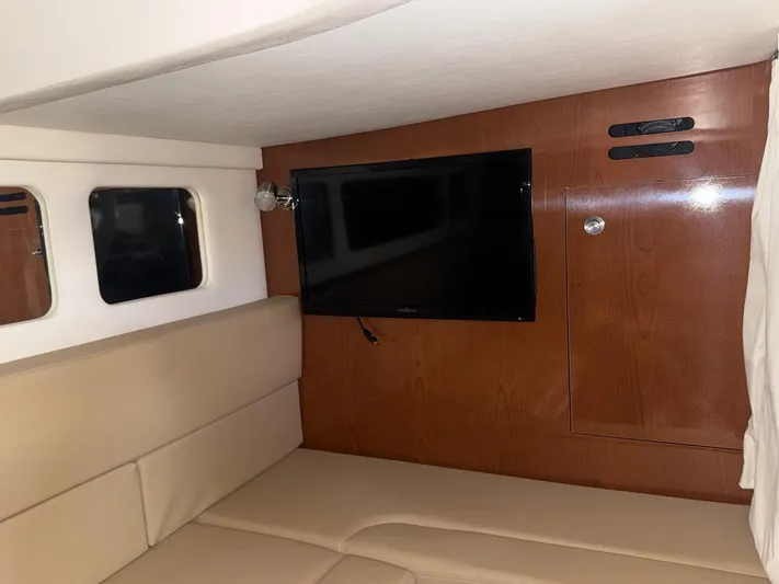 Max Dream Yacht Photos Pics Interior of 2014 Sea Ray 330 Sundancer with TV and beige seating.