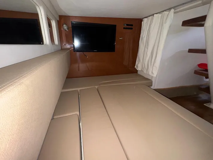 Max Dream Yacht Photos Pics Interior cabin of 2014 Sea Ray 330 Sundancer with beige seating and wall-mounted TV.