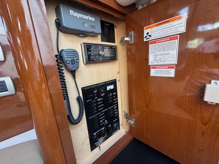 Max Dream Yacht Photos Pics 2014 Sea Ray 330 Sundancer control panel with Raymarine equipment and warning labels.