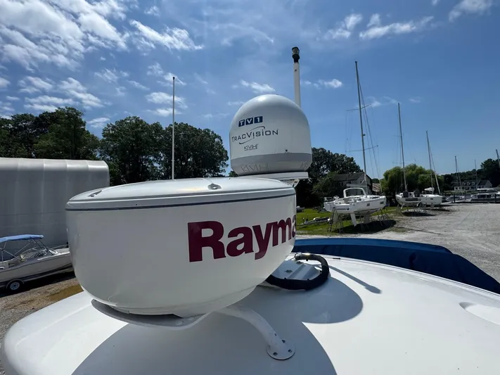 Max Dream Yacht Photos Pics Radar and satellite equipment on 2014 Sea Ray 330 Sundancer boat under blue sky.