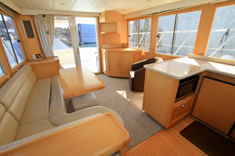  Yacht Photos Pics Interior of 1999 McKinna 47 Sedan yacht with spacious seating and modern amenities.