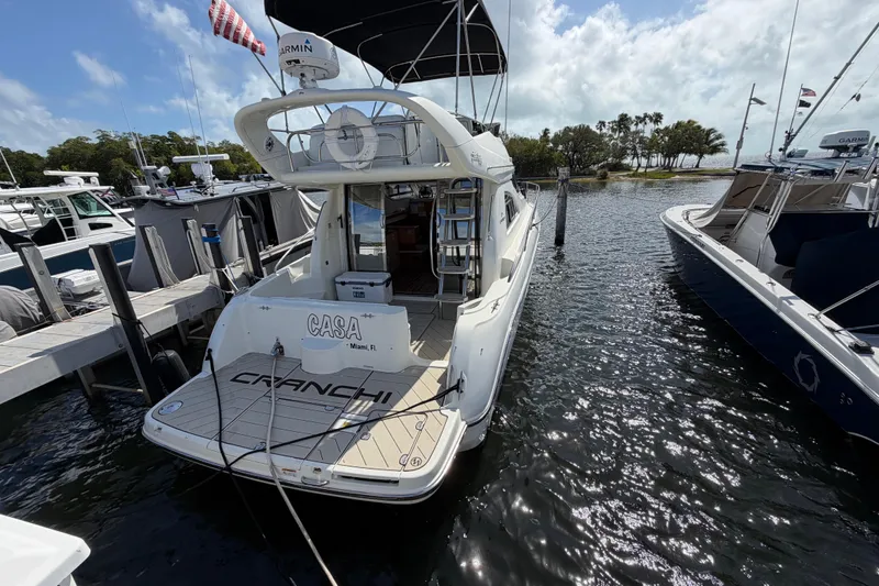  Yacht Photos Pics 2007 Cranchi Atlantique 40 yacht docked at marina, rear view with clear skies.
