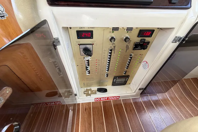  Yacht Photos Pics Electrical control panel on 2007 Cranchi Atlantique 40 yacht, displaying voltage and switches.