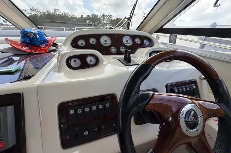  Yacht Photos Pics Dashboard of 2007 Cranchi Atlantique 40 yacht with steering wheel and control gauges.