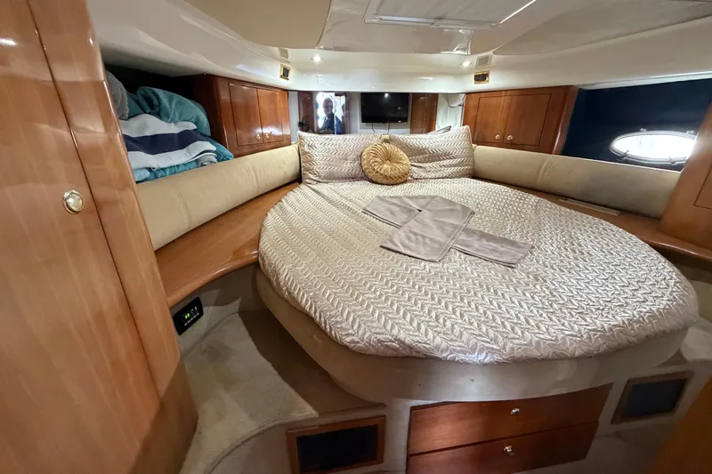  Yacht Photos Pics Luxurious cabin interior of 2007 Cranchi Atlantique 40 yacht with cozy bedding.