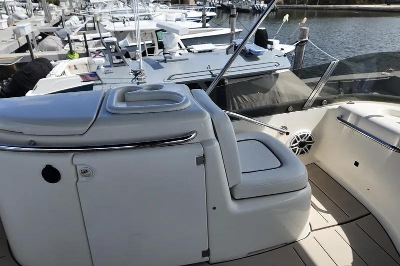  Yacht Photos Pics 2007 Cranchi Atlantique 40 yacht interior with seating and docked boats in background.