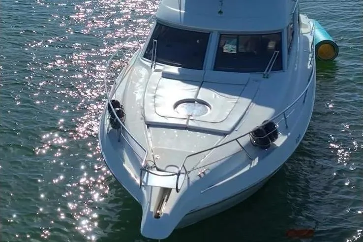  Yacht Photos Pics 2007 Cranchi Atlantique 40 yacht on sparkling water, front view.