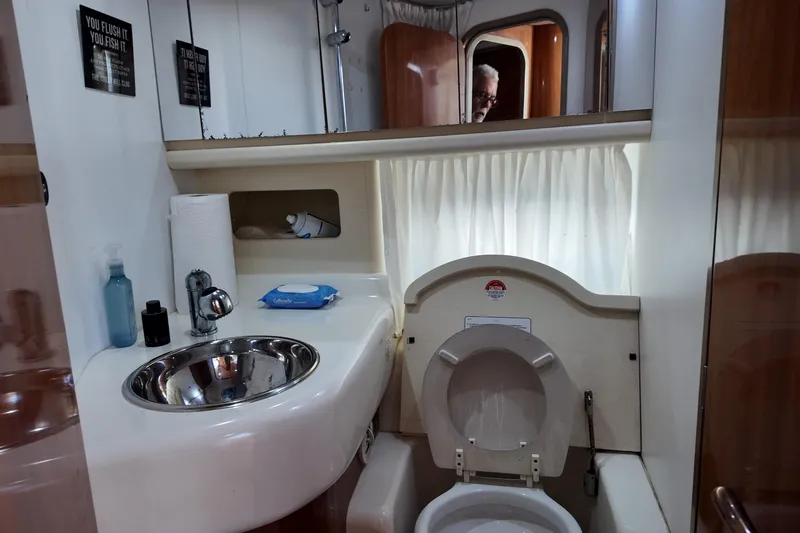  Yacht Photos Pics Bathroom interior of 2007 Cranchi Atlantique 40 yacht with sink and toilet.