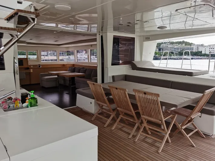 Er Yue Hua Hao Yacht Photos Pics Luxurious 2014 Lagoon 620 yacht interior with spacious seating and dining area.