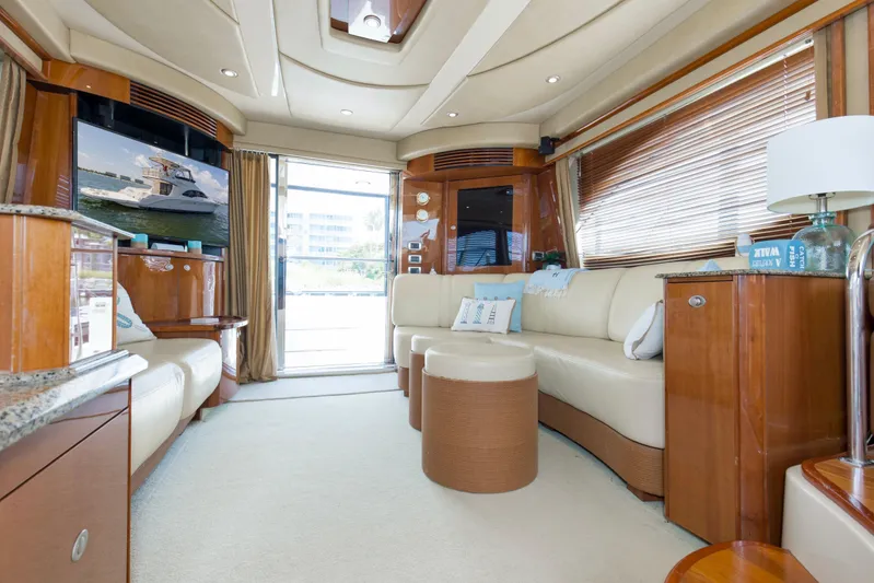 Reel Destiny Yacht Photos Pics Luxurious interior of 2007 Sea Ray 52 Sedan Bridge yacht with elegant seating and modern amenities.