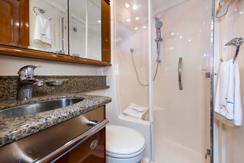 Reel Destiny Yacht Photos Pics Luxurious bathroom in 2007 Sea Ray 52 Sedan Bridge yacht with granite countertop and shower.