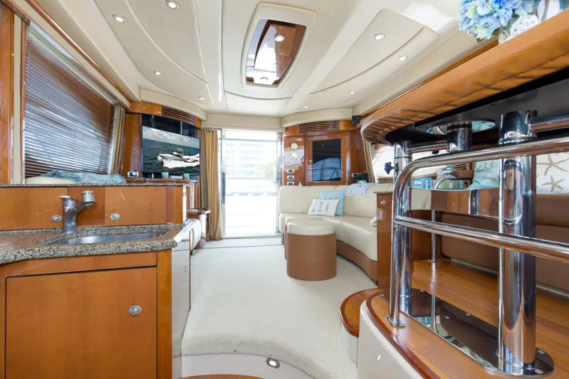 Reel Destiny Yacht Photos Pics Luxurious interior of 2007 Sea Ray 52 Sedan Bridge yacht with elegant furnishings.