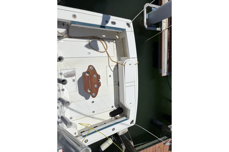 Free 2 Go Yacht Photos Pics 2006 Rampage 38 Express boat docked, aerial view of deck and fishing equipment.