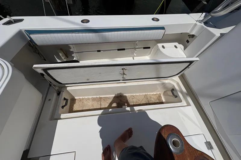 Free 2 Go Yacht Photos Pics Open storage compartment on 2006 Rampage 38 Express boat deck.