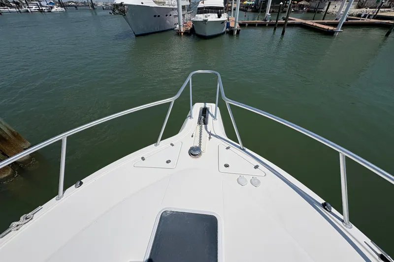 Free 2 Go Yacht Photos Pics Bow view of 2006 Rampage 38 Express yacht docked in marina.