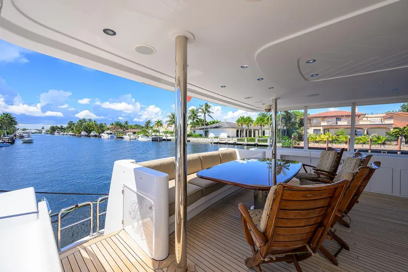 Remy Roo Yacht Photos Pics Luxurious 2014 Westport 112 yacht deck with elegant seating and scenic waterfront view.