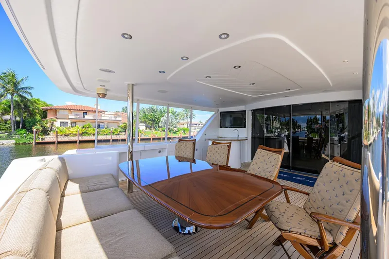 Remy Roo Yacht Photos Pics Luxurious 2014 Westport 112 yacht deck with elegant seating and waterfront view.